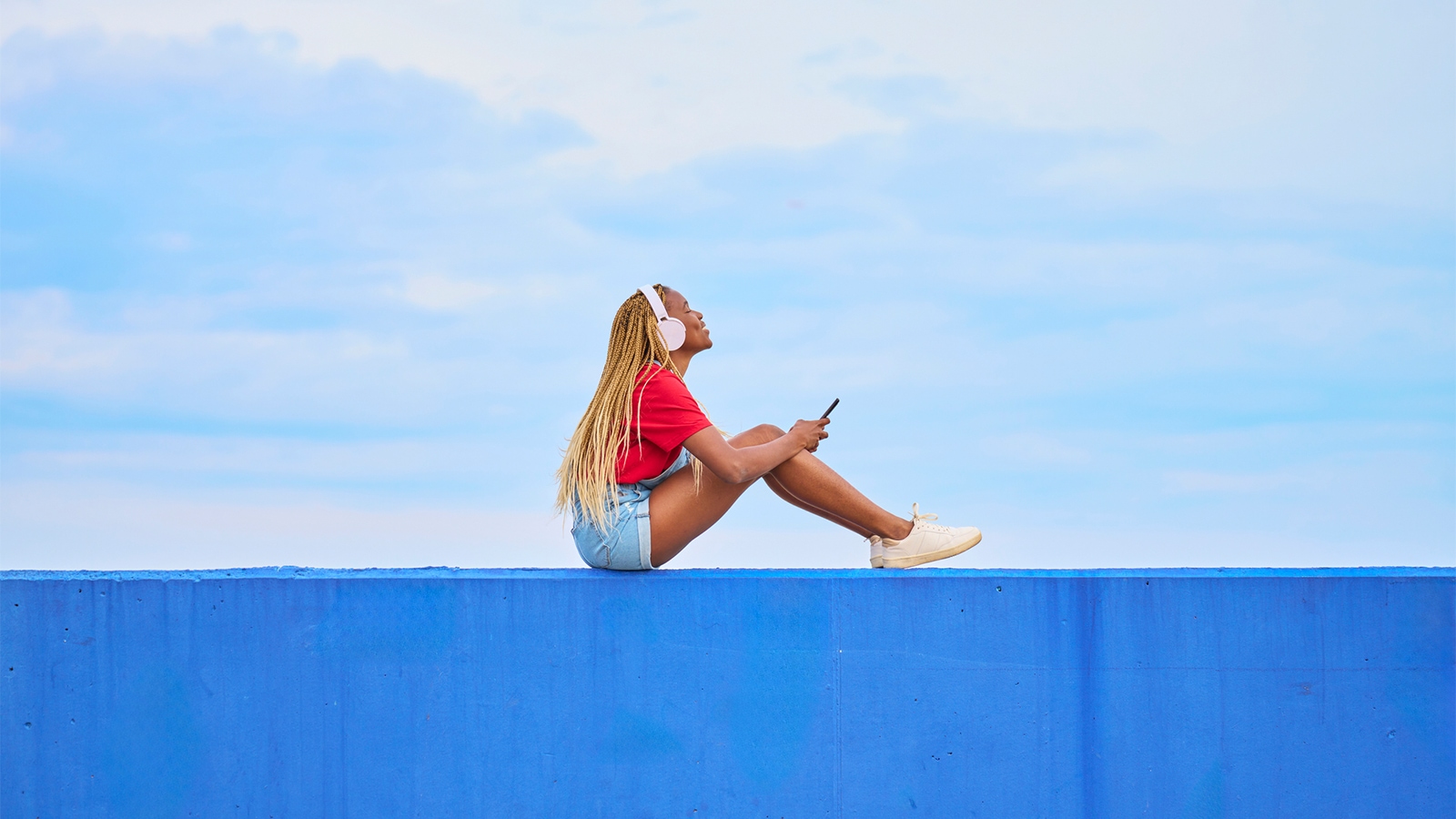 Woman wearing headphones listening to music